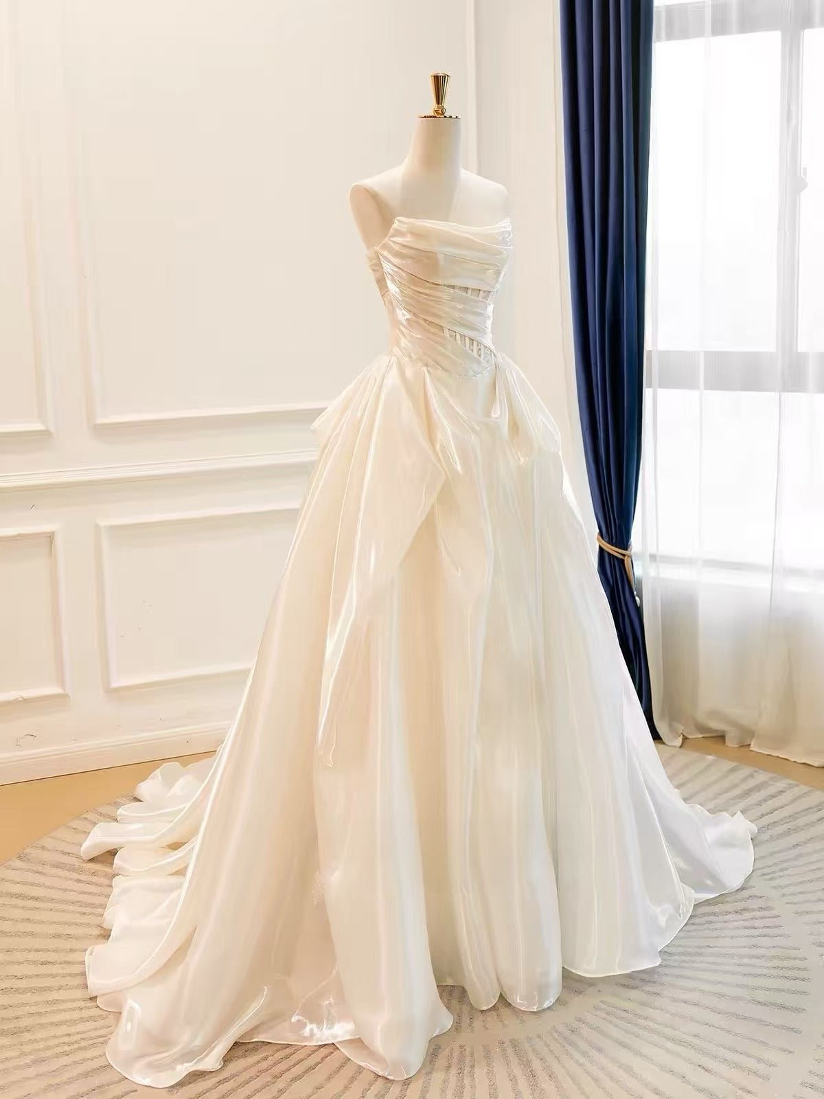 Elegant Ivory Strapless Ruched A-Line Prom Dress with Draped Bodice and Flowing Skirt